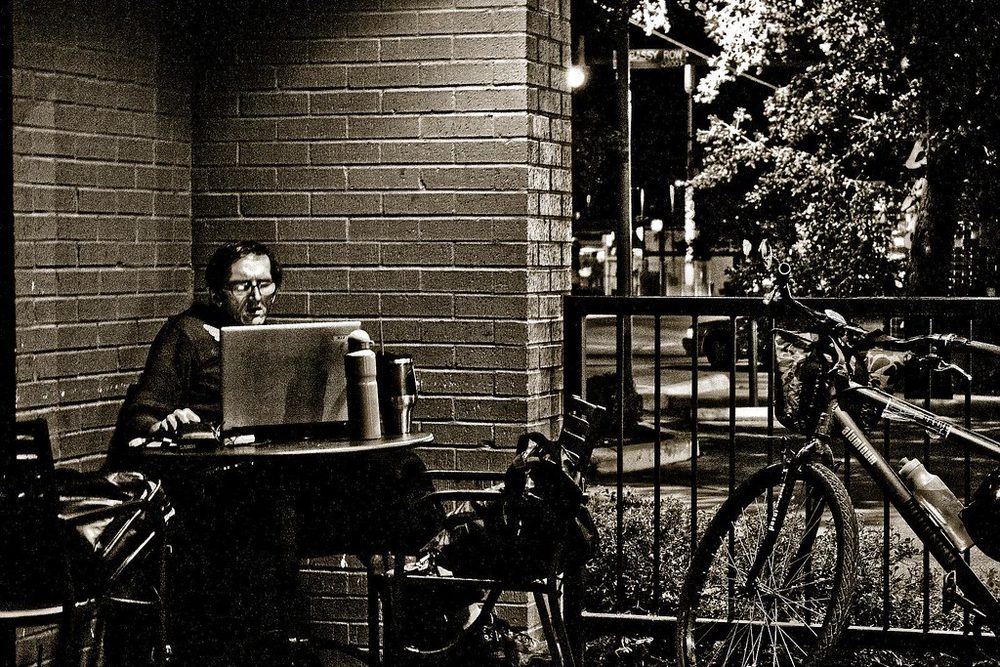 Someone working alone at a desk